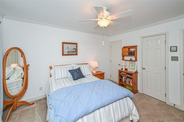 bedroom featuring carpet floors, ornamental molding, baseboards, and ceiling fan