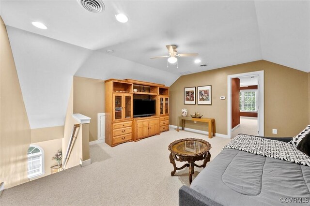 carpeted bedroom featuring visible vents, a ceiling fan, baseboards, and lofted ceiling