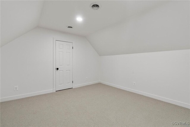bedroom with baseboards, a barn door, light wood-style flooring, and ceiling fan