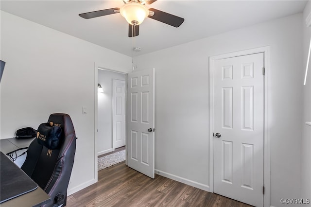 office area featuring baseboards, a ceiling fan, and wood finished floors