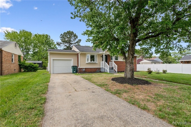 single story home with concrete driveway, an attached garage, fence, and a front yard