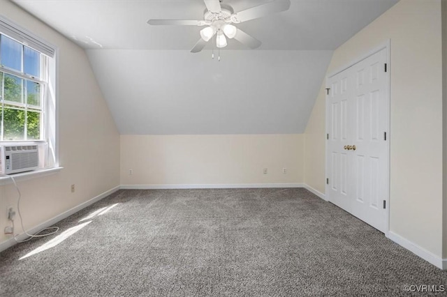 additional living space featuring carpet floors, lofted ceiling, and cooling unit