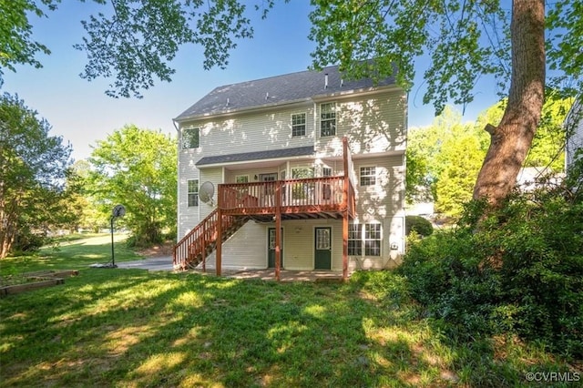 back of house featuring a lawn, a patio, a deck, and stairway