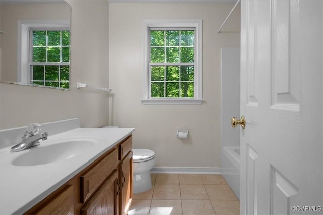 full bath with vanity, tile patterned flooring, a wealth of natural light, and toilet