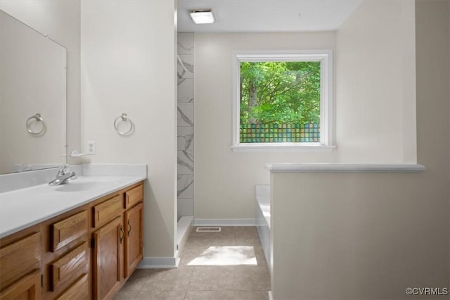 bathroom with a washtub, visible vents, tile patterned flooring, walk in shower, and vanity