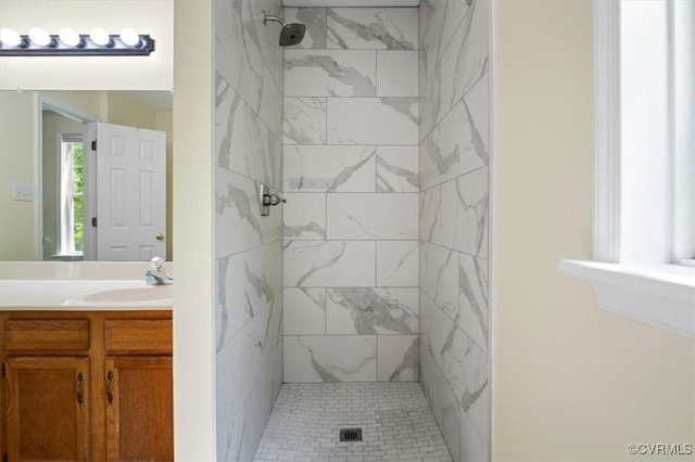 bathroom with vanity and a stall shower