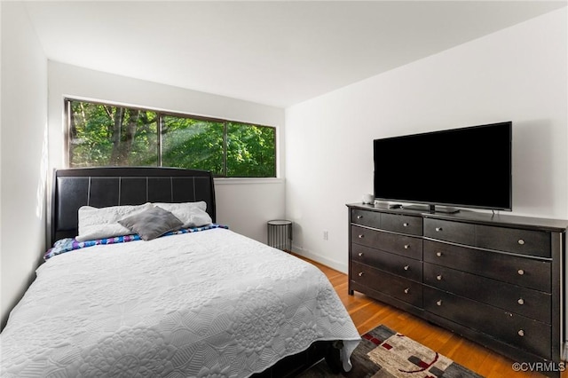 bedroom featuring wood finished floors