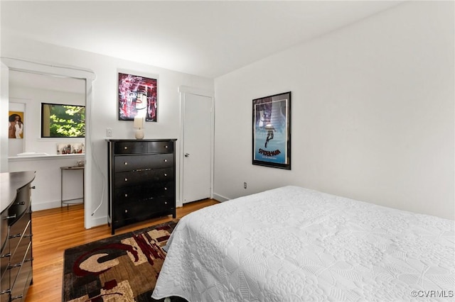 bedroom featuring wood finished floors
