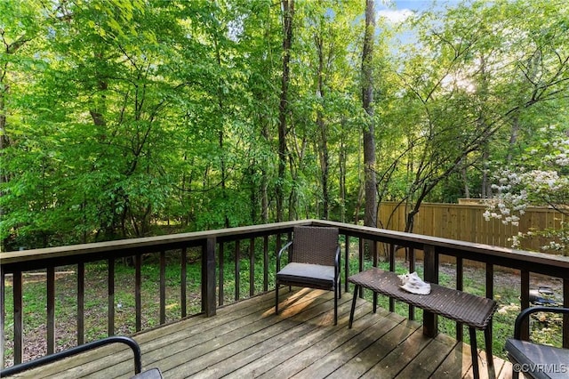 wooden deck featuring fence