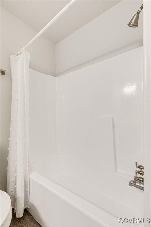 full bathroom with toilet and shower / tub combo