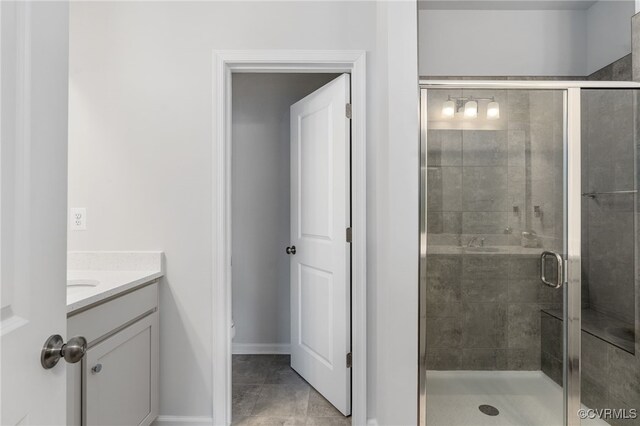 bathroom featuring vanity, tile patterned floors, toilet, and a shower stall