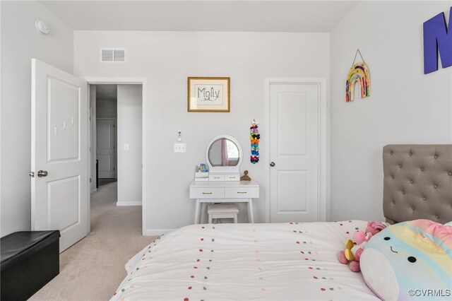 bedroom featuring baseboards, carpet flooring, and visible vents