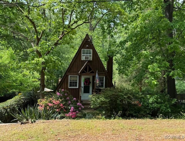view of outbuilding with a view of trees
