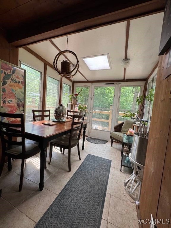 sunroom / solarium featuring a wealth of natural light and tile patterned flooring