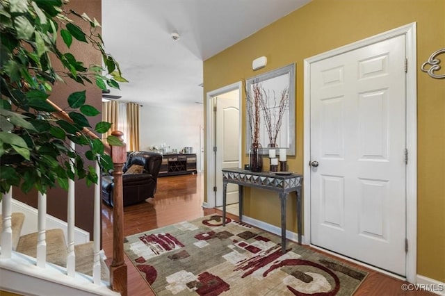 foyer featuring wood finished floors