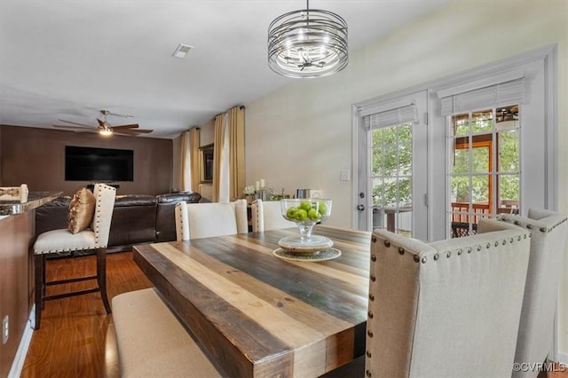dining room with ceiling fan and wood finished floors