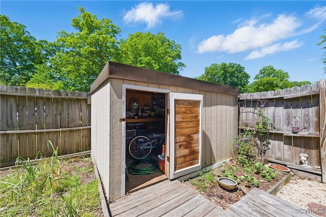 view of shed with a fenced backyard