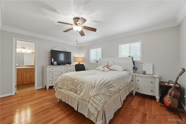 bedroom with light wood-style floors, a sink, ceiling fan, and ornamental molding