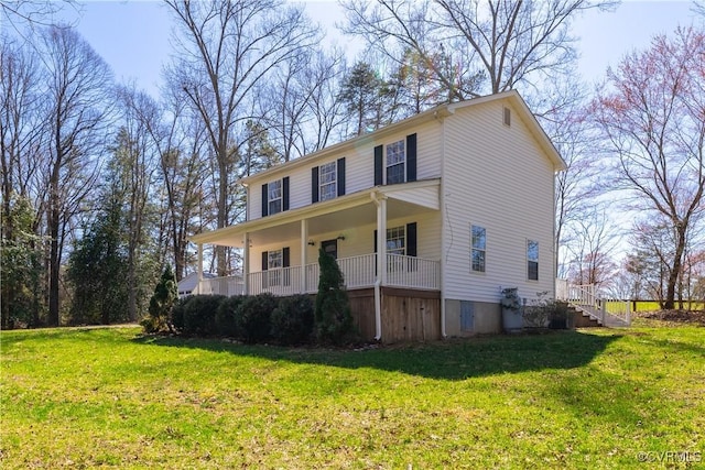view of front of house featuring covered porch and a front yard