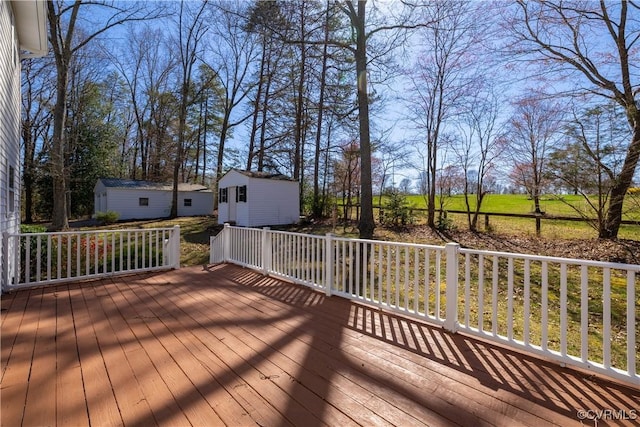 wooden deck featuring an outbuilding