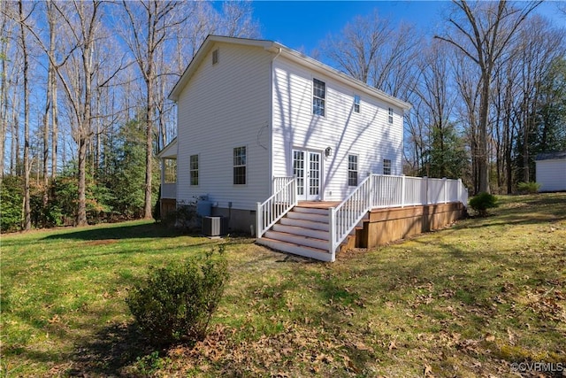 back of house featuring a yard, a deck, central AC unit, and french doors