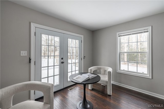 entryway featuring baseboards, dark wood-style floors, and french doors
