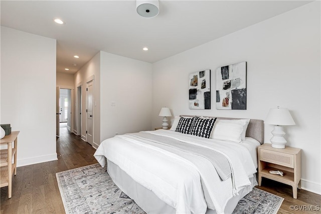 bedroom with baseboards, recessed lighting, and wood finished floors