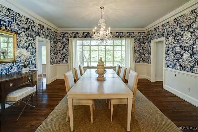 dining space with crown molding, wallpapered walls, an inviting chandelier, and dark wood-type flooring