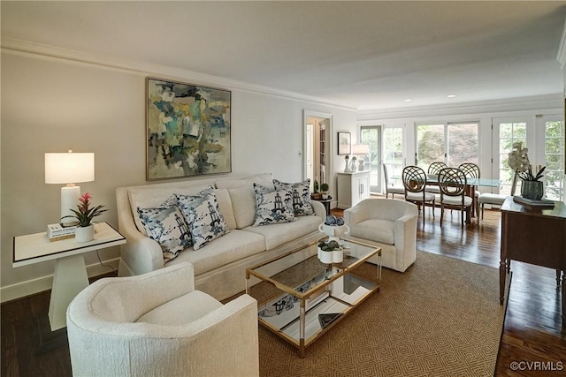 living area with crown molding, baseboards, and dark wood-type flooring