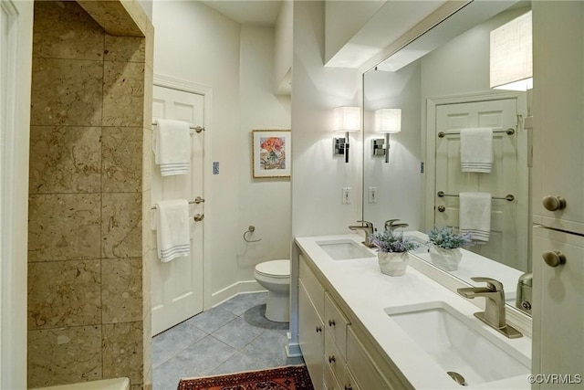 full bath featuring a sink, walk in shower, tile patterned floors, and toilet