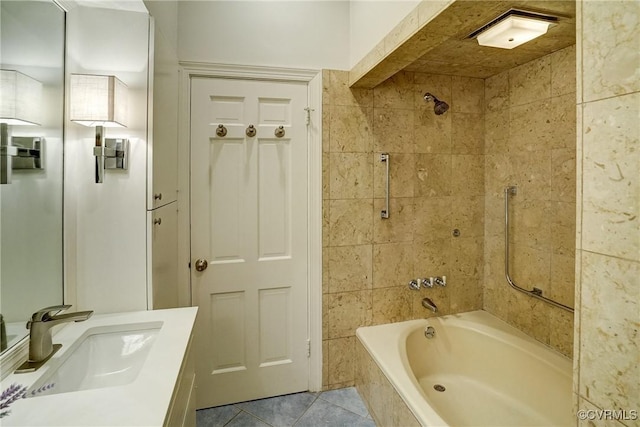 full bathroom with tiled shower / bath combo, tile patterned flooring, and vanity