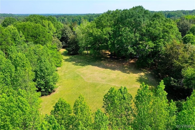 aerial view featuring a wooded view