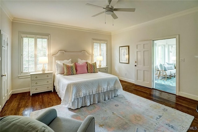 bedroom featuring crown molding, baseboards, multiple windows, and wood finished floors