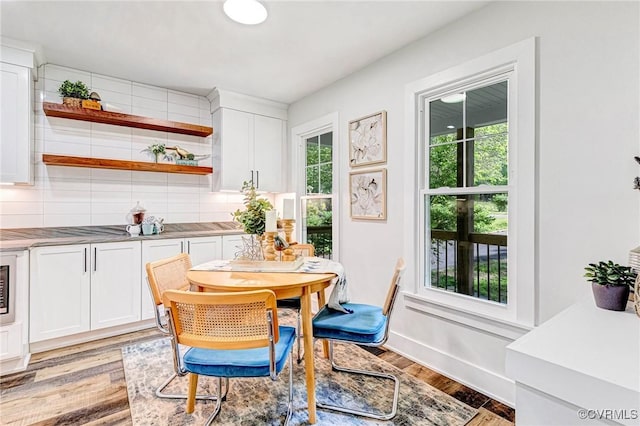 dining area with light wood-style flooring