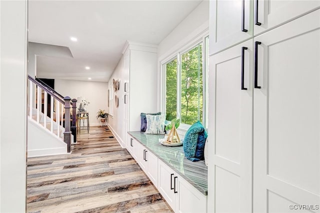 mudroom with recessed lighting, baseboards, and light wood-style flooring