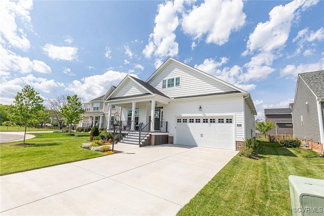 craftsman-style house featuring a porch, driveway, a front yard, and a garage