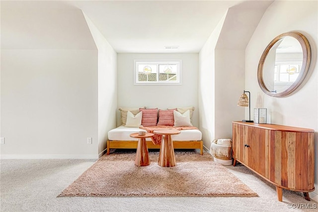 sitting room featuring visible vents, carpet, and baseboards