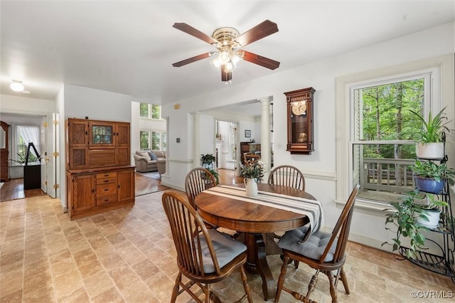 dining room with baseboards and ceiling fan