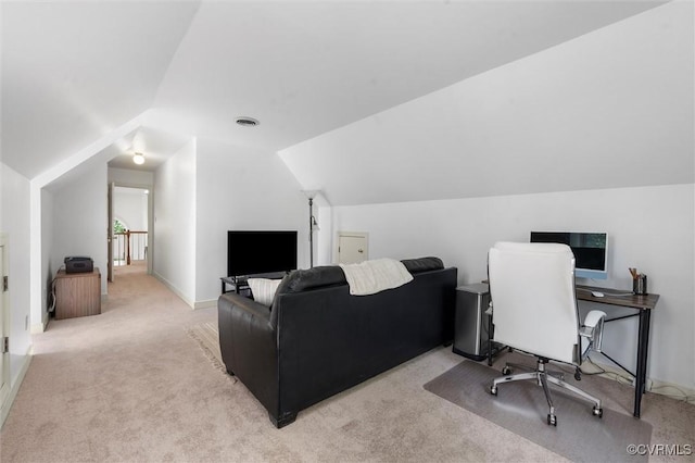carpeted office featuring baseboards, visible vents, and lofted ceiling