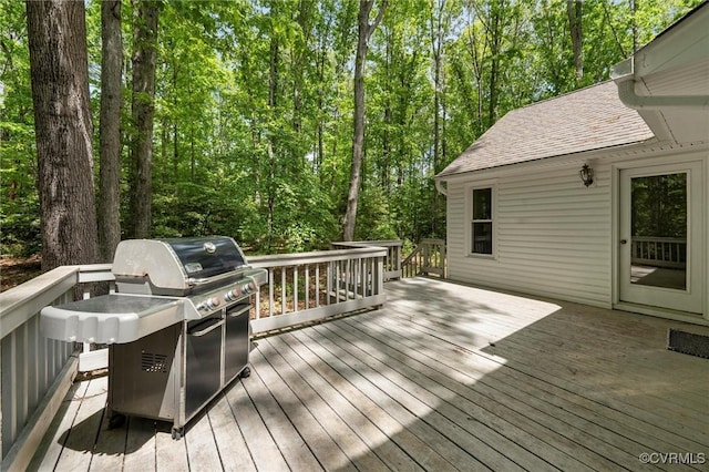 wooden terrace featuring area for grilling