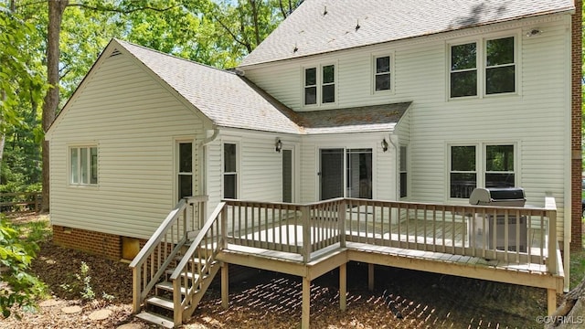 back of house with a shingled roof, crawl space, and a deck