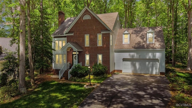 view of front facade with a garage, a front lawn, aphalt driveway, roof with shingles, and a chimney