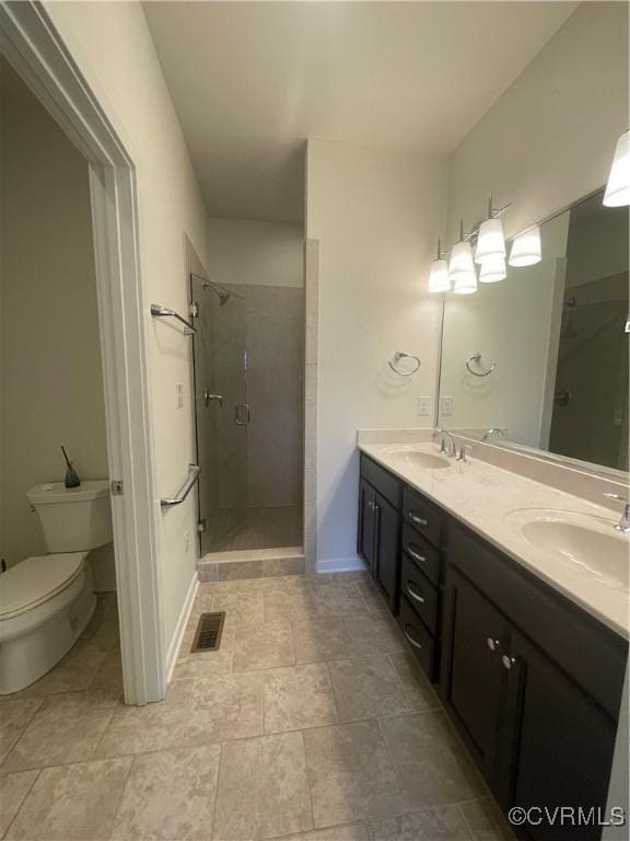 bathroom with visible vents, a shower stall, and a sink
