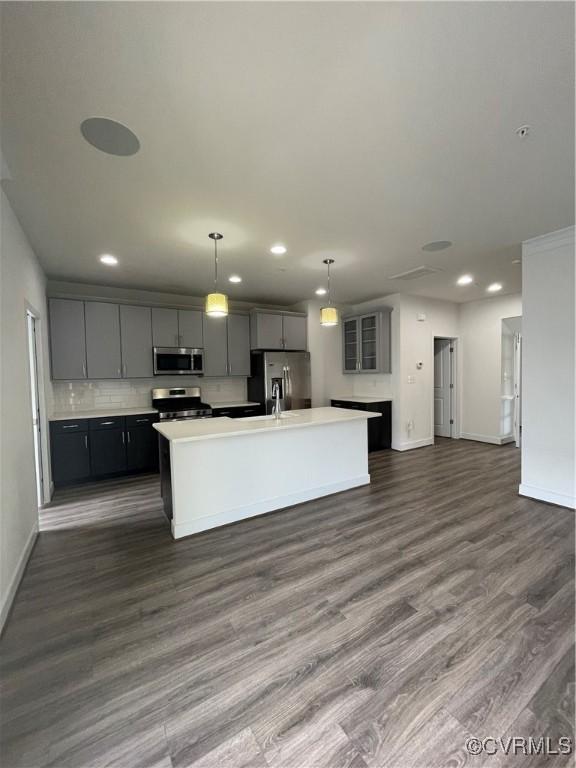 kitchen with stainless steel appliances, baseboards, and recessed lighting