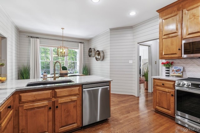 2951 W Maple Grove Ln, Powhatan, VA 23139 - kitchen featuring appliances with stainless steel finishes, a sink, backsplash, light stone counters, and a chandelier