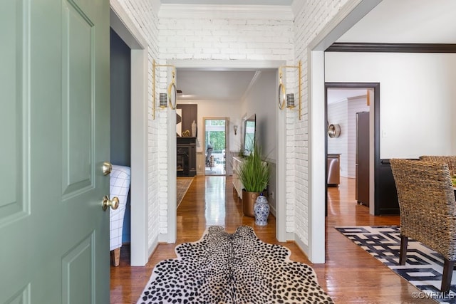 2951 W Maple Grove Ln, Powhatan, VA 23139 - corridor with wood finished floors, ornamental molding, and brick wall