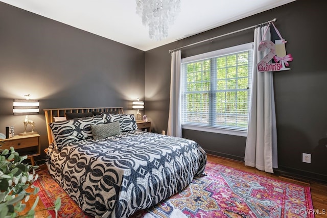 2951 W Maple Grove Ln, Powhatan, VA 23139 - bedroom with wood finished floors, a chandelier, and baseboards