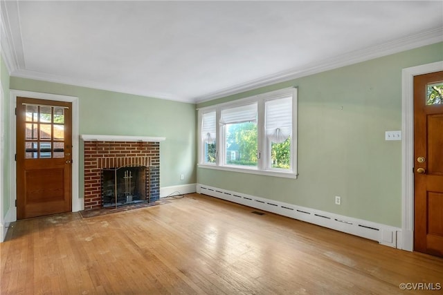 102 Norman Dr, Henrico, VA 23227 - unfurnished living room featuring ornamental molding, baseboard heating, and hardwood / wood-style floors
