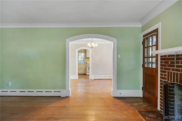 102 Norman Dr, Henrico, VA 23227 - interior space featuring arched walkways, a baseboard radiator, ornamental molding, and wood finished floors