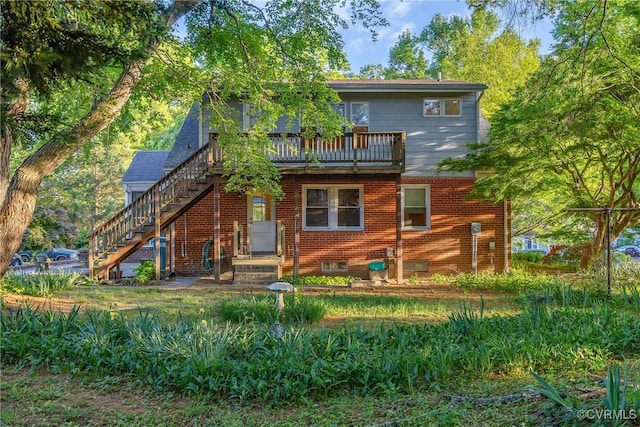102 Norman Dr, Henrico, VA 23227 - rear view of house featuring brick siding, a wooden deck, and stairway